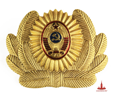 Badge "Coat of arms of the USSR"  Beautiful grand badge of the Soviet period. Material anodized aluminum with multi-colored enamel filling. Golden color cockade made for headgear, emphasizes the importance of aesthetics and decoration military uniform and is undoubtedly of interest in the original as a memorable gift for someone who appreciates the history of furniture uniforms employees of the Soviet Union. Badges size 45h58 mm. 